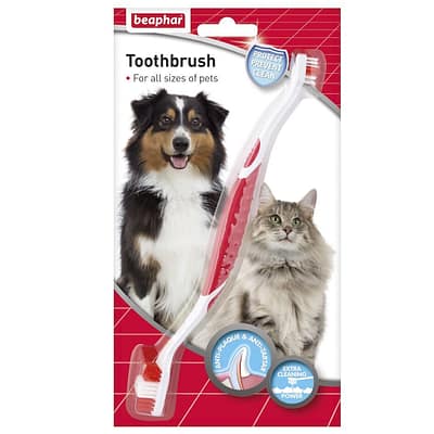 Blister pack containing a double ended toothbrush, with a picture of a cat and dog