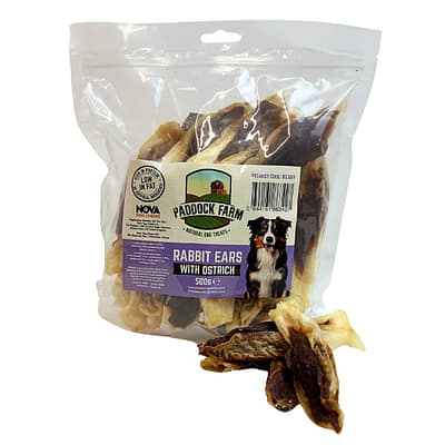 Pack of Rabbit ears dog treats stuffed with ostrich meat, with some loose in front of the pack