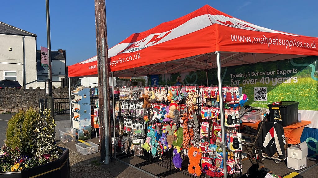MAH Pet Supplies pop-up pet shop stall in Clowne, featuring a wide range of natural dog treats, KONG toys, and Halti training gear