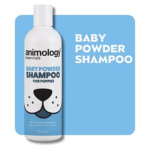 Bottle of Animology Baby Powder Shampoo on a baby blue background