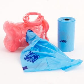 Pink Bone shaped Poo bag dispenser with blue bag coming out of the aperture