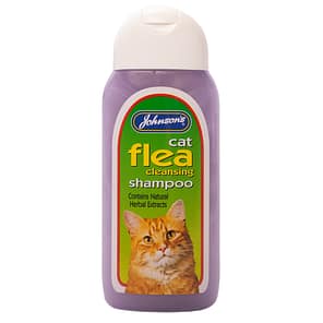 Bottle of cat flea shampoo with ginger cat on label