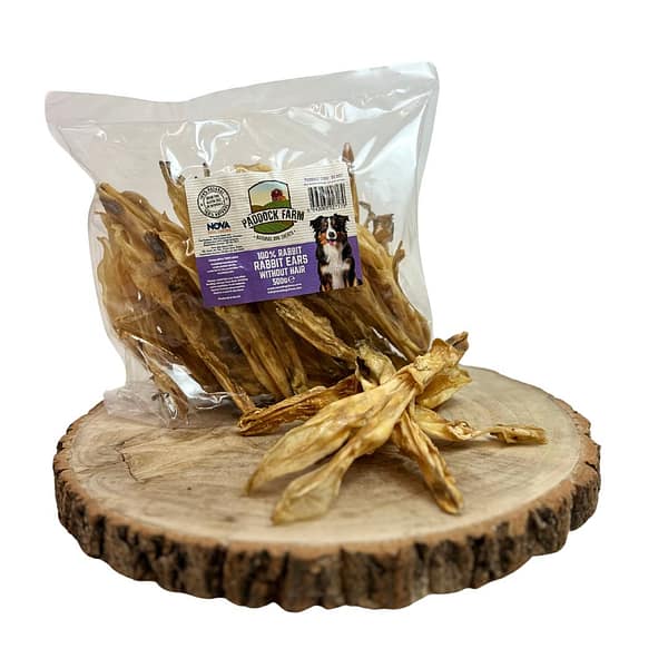 Pack of Hairless Rabbit Ear natural dog treats on a display tree stump