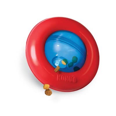 KONG Gyro treat dispensing dog toy, red ring round a blue sphere with hole