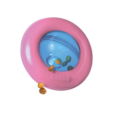 KONG Puppy Gyro Pink outer Ring, Blue centre ball, with treats spilling from the hole